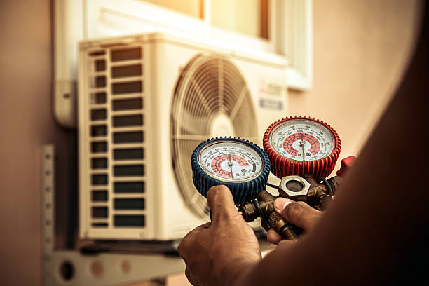 Professional Air Conditioning Service technician working in Williamstown, WV